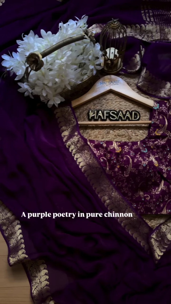 A pure chinnon purple jacquard and embroidery saree is a stunning choice for traditional and festive occasions