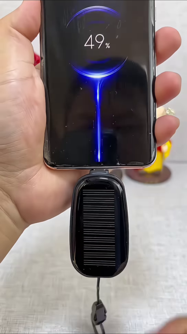 Compact Solar Powered Mobile Device Charger - Portable Energy Solution for Smartphones