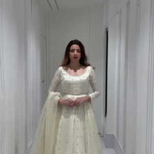 Radiant in Off-White: Flowing Anarkali with Subtle Silver Sparkle.