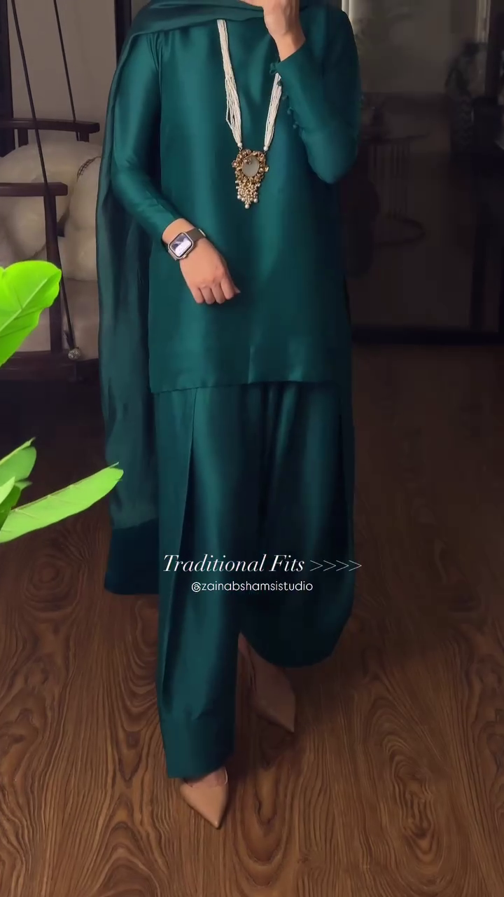 The Regal Emerald Draped: Luxurious Silk Kurta and Contemporary Pleated Shalwar Set.