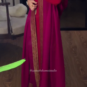 The Power Cape: Fuchsia Draped Shawl Over a Slim Ruby Red Suit.