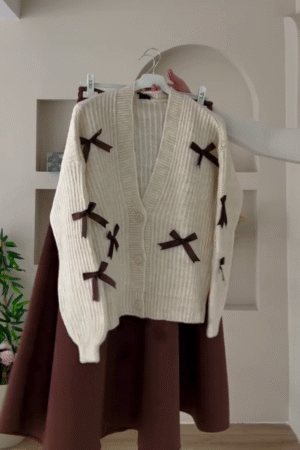 🎀 "Classic Romantic Ribbed Pearl Off-White Cardigan Embellished with Vintage Brown Bows for Lovers of Soft Feminine Dreamy Outfits" 🎀