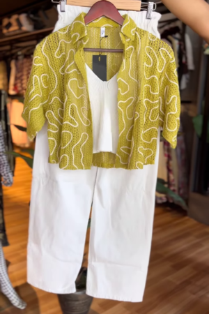 The Power Cape: Fuchsia Draped Shawl Over a Slim Ruby Red Suit.